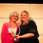 Janice Shearer receives the 2023 Women of Distinction Award in the Lifetime Achievement Category from Award Sponsor, Starward Homes.